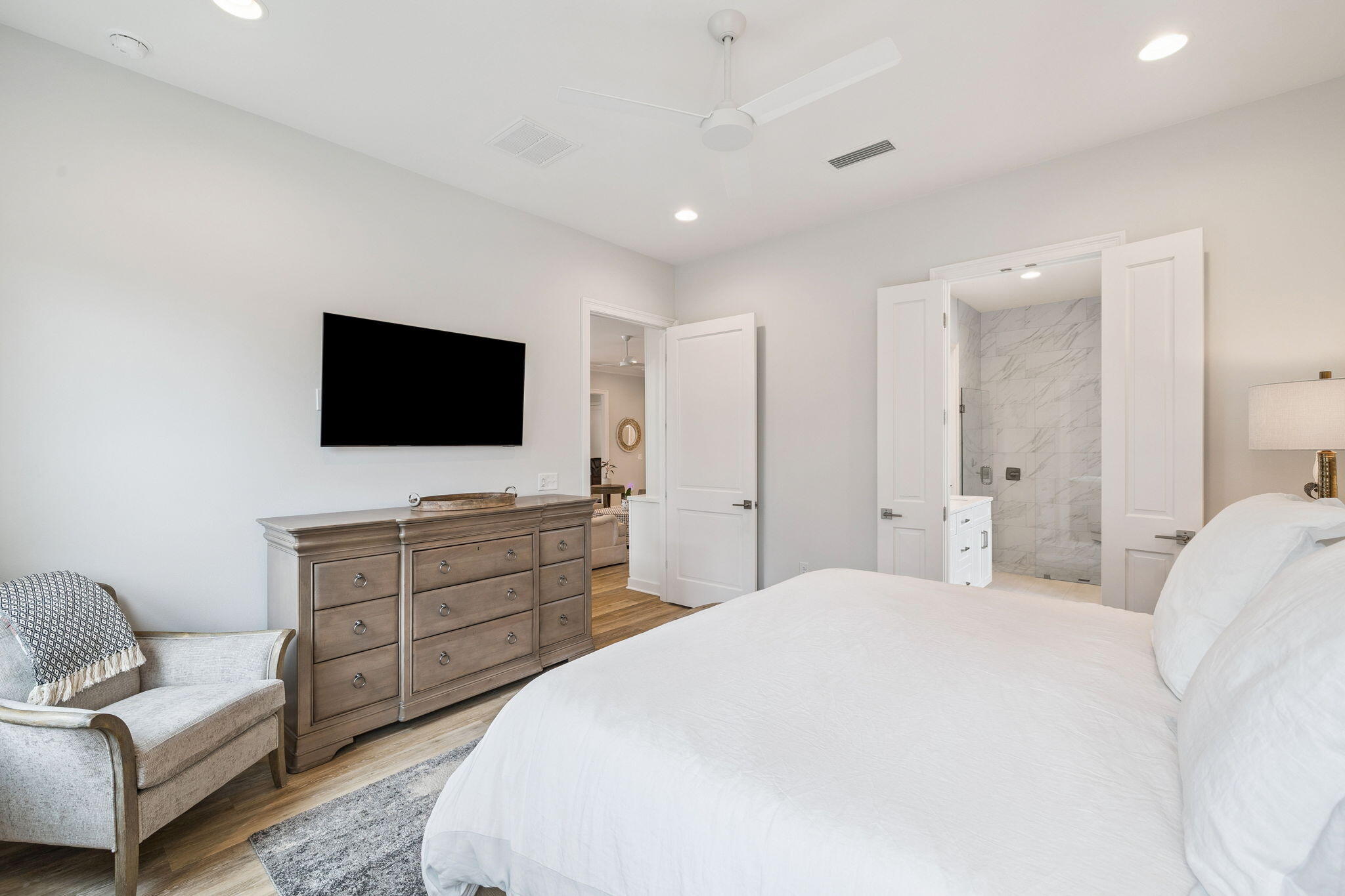 129 Suwannee Dr Inlet Beach Inlet Beach, FL 32461 - Photo 18 of 43 a spacious bedroom with a bed and a flat screen tv