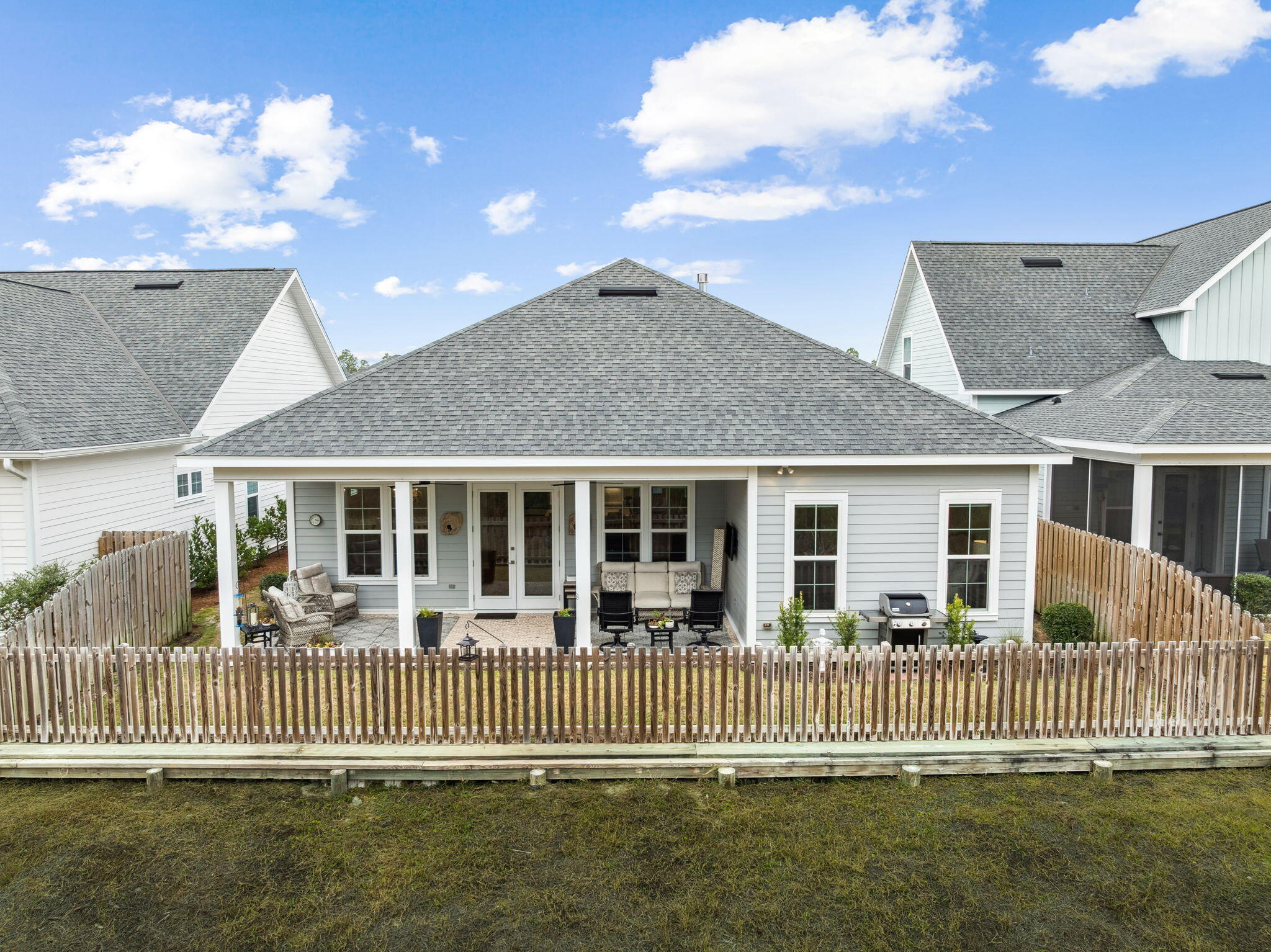 129 Suwannee Dr Inlet Beach Inlet Beach, FL 32461 - Photo 37 of 43 a front view of a house with a garden