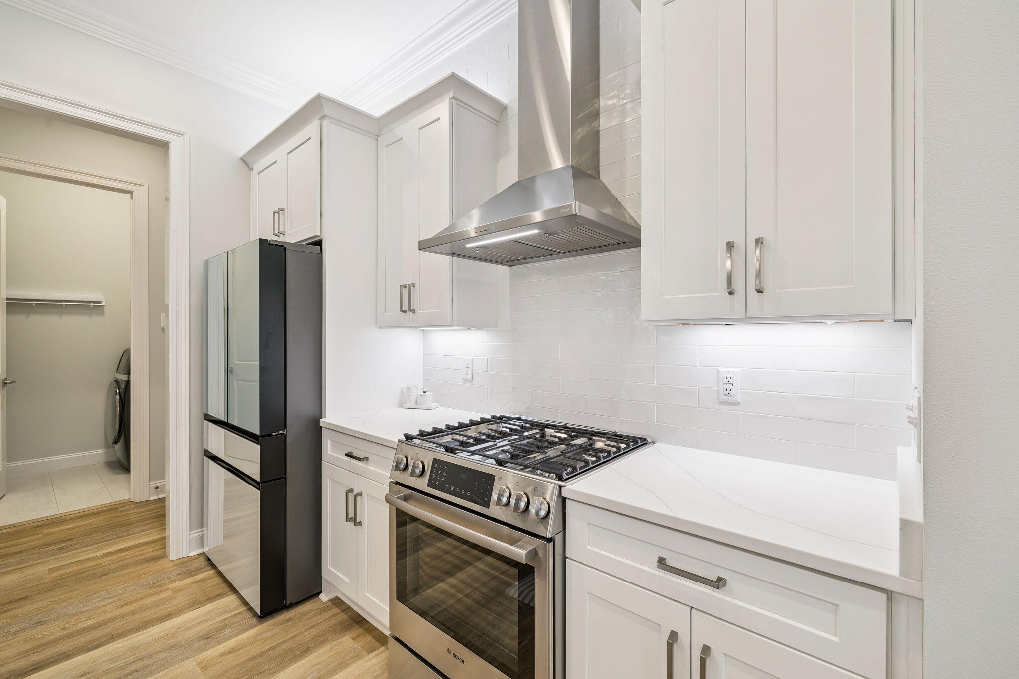 129 Suwannee Dr Inlet Beach Inlet Beach, FL 32461 - Photo 9 of 43 a kitchen with stainless steel appliances a refrigerator stove and cabinets