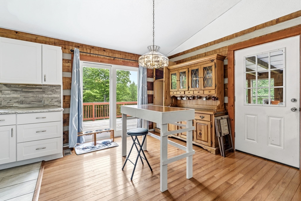 22 Lyon Hill Road Chester, MA 01011 - Photo 16 of 38 a view of a dining room with furniture window and wooden floor