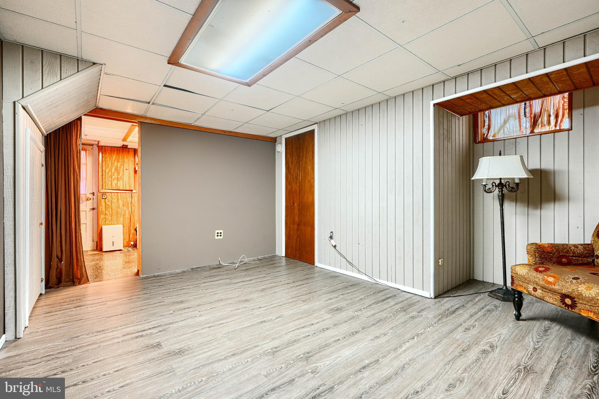 2 Haley Road Essex, MD 21221 - Photo 20 of 32 a view of a room with wooden floor and a window