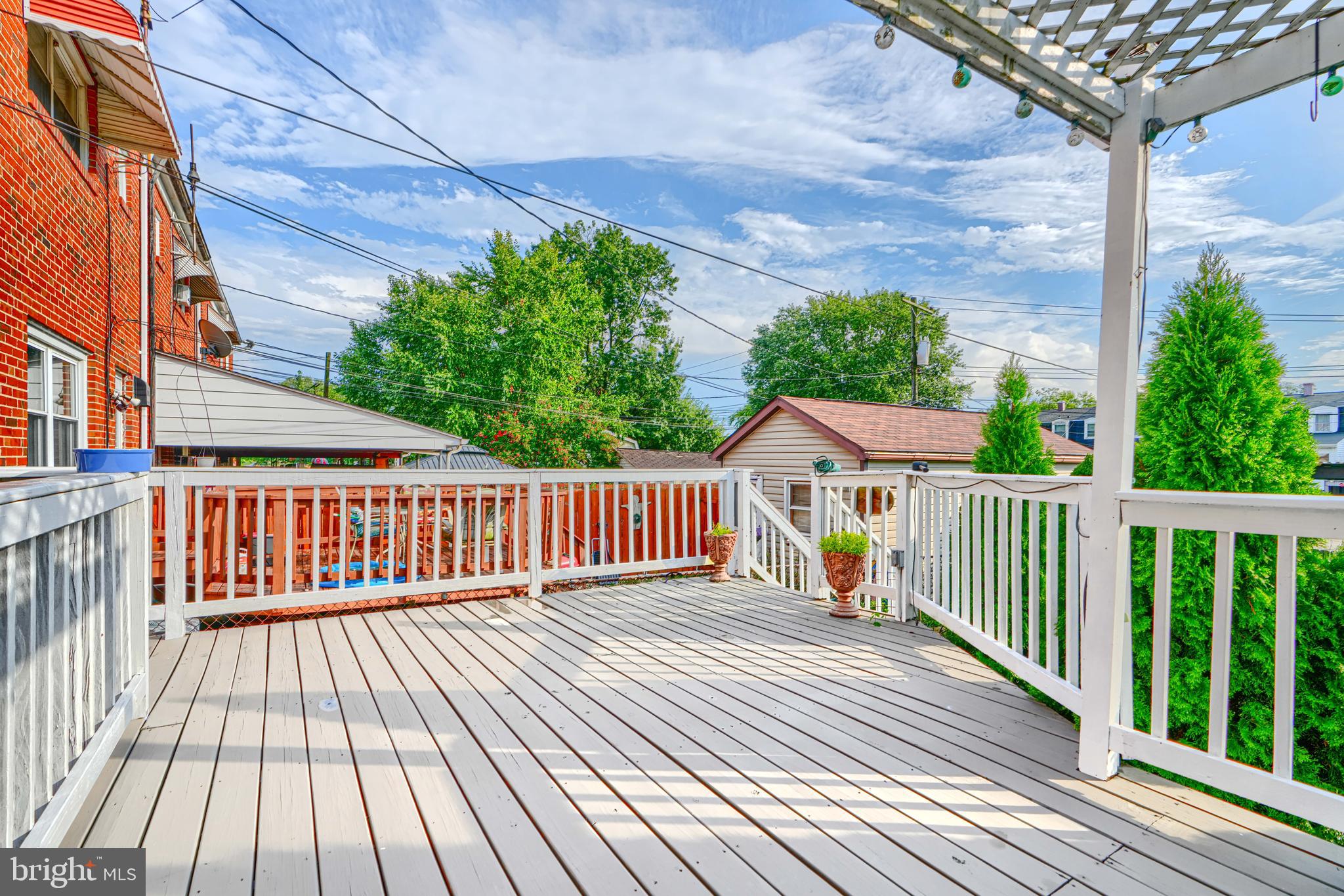 2 Haley Road Essex, MD 21221 - Photo 24 of 32 a view of a wooden deck with a yard