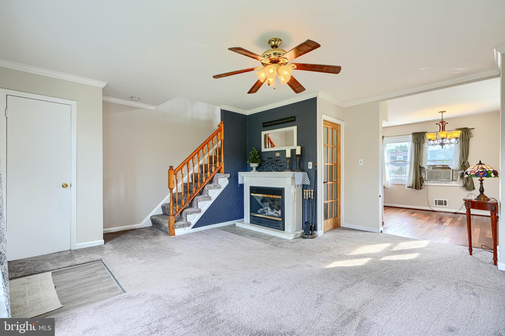 2 Haley Road Essex, MD 21221 - Photo 3 of 32 a view of a livingroom with a staircase and a ceiling fan