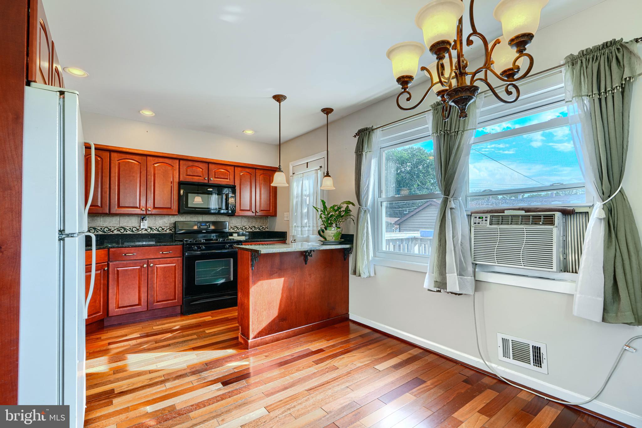 2 Haley Road Essex, MD 21221 - Photo 6 of 32 a kitchen with stainless steel appliances granite countertop a refrigerator and a stove top oven