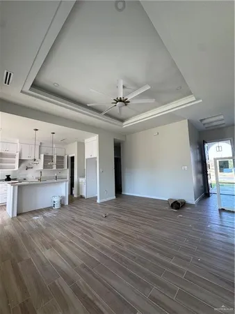 a view of a kitchen with a sink and cabinets
