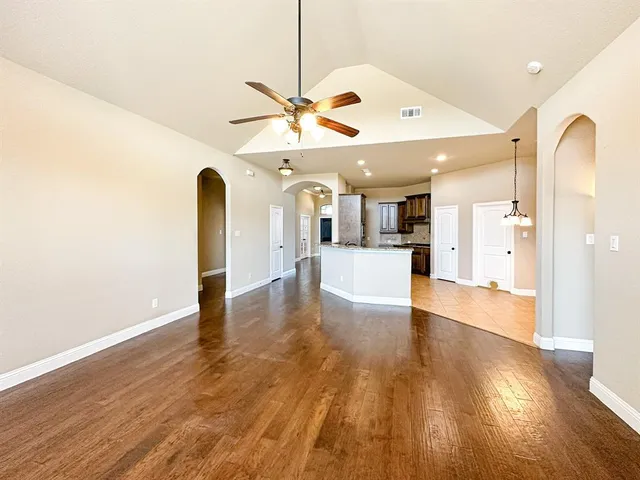 a view of a kitchen with a sink and a window