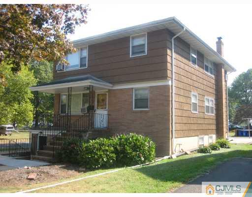 649 Inman Avenue Colonia, NJ 07067 - Photo 1 of 1 a front view of a house with garden