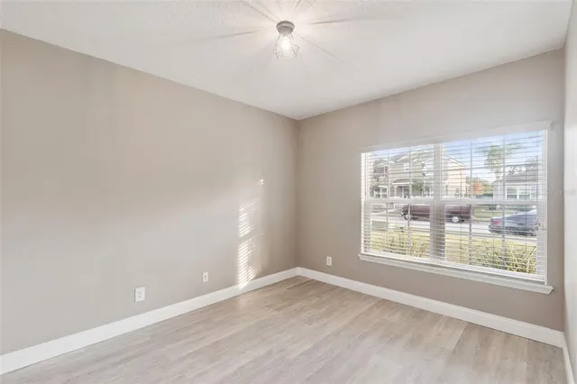 a view of an empty room with a window