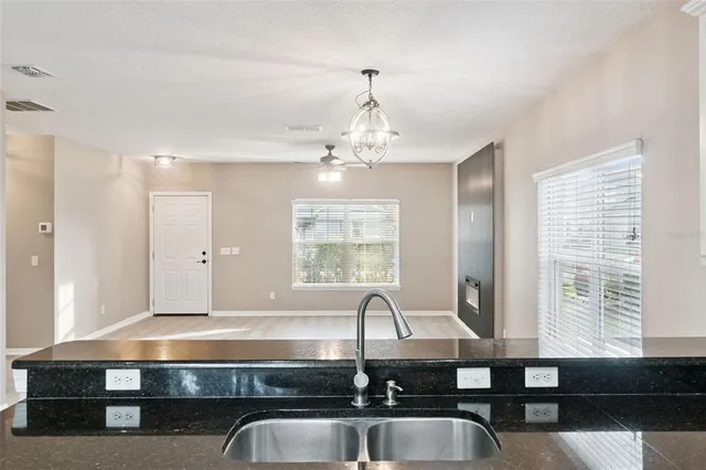 a bathroom with a sink and a large mirror