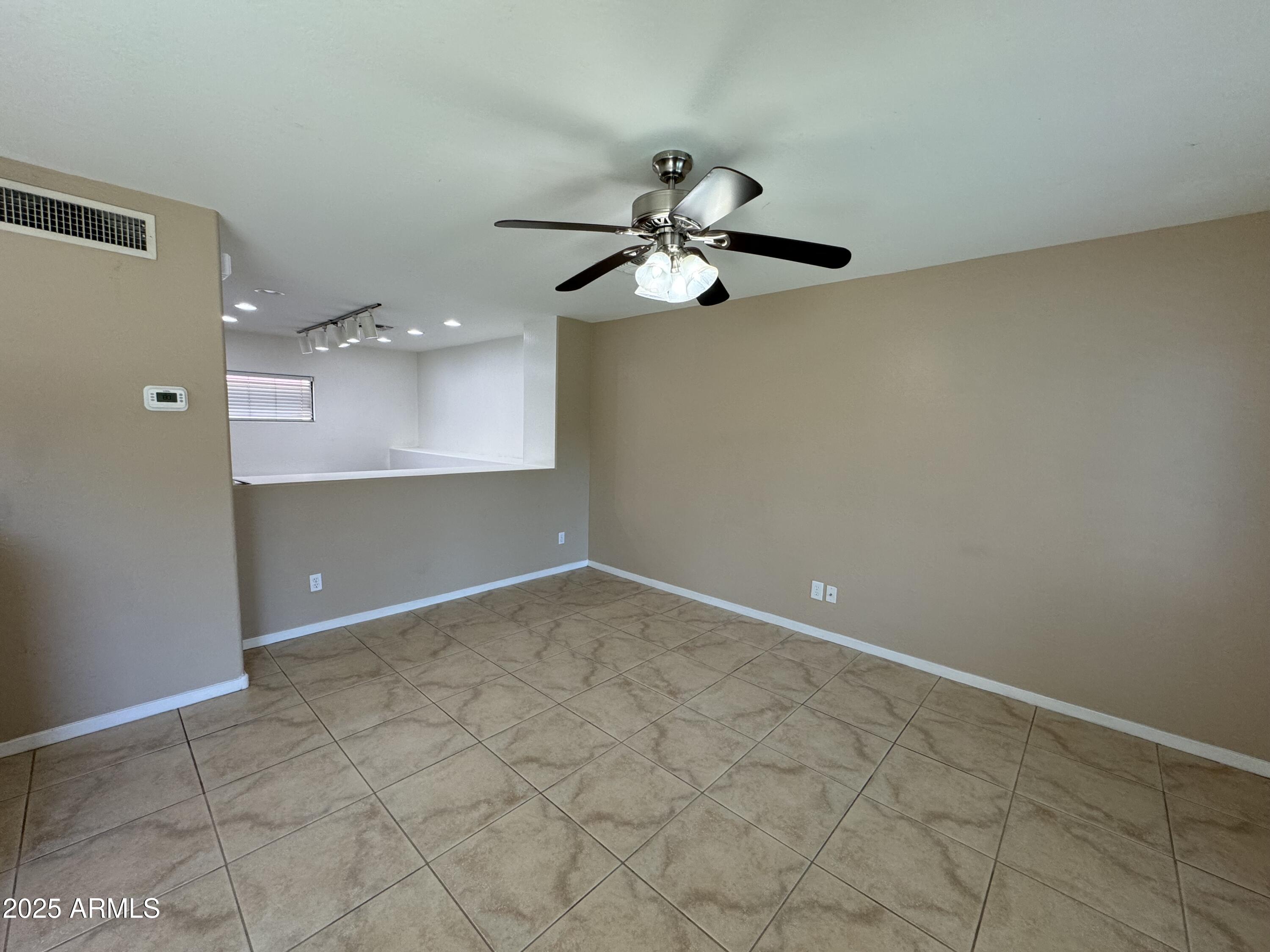 305 South Wilson Street, Unit 111 Tempe, AZ 85281 - Photo 40 of 48 a view of a room with a ceiling fan and wooden floor