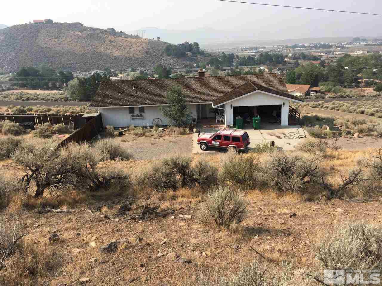 a view of a houses with a yard