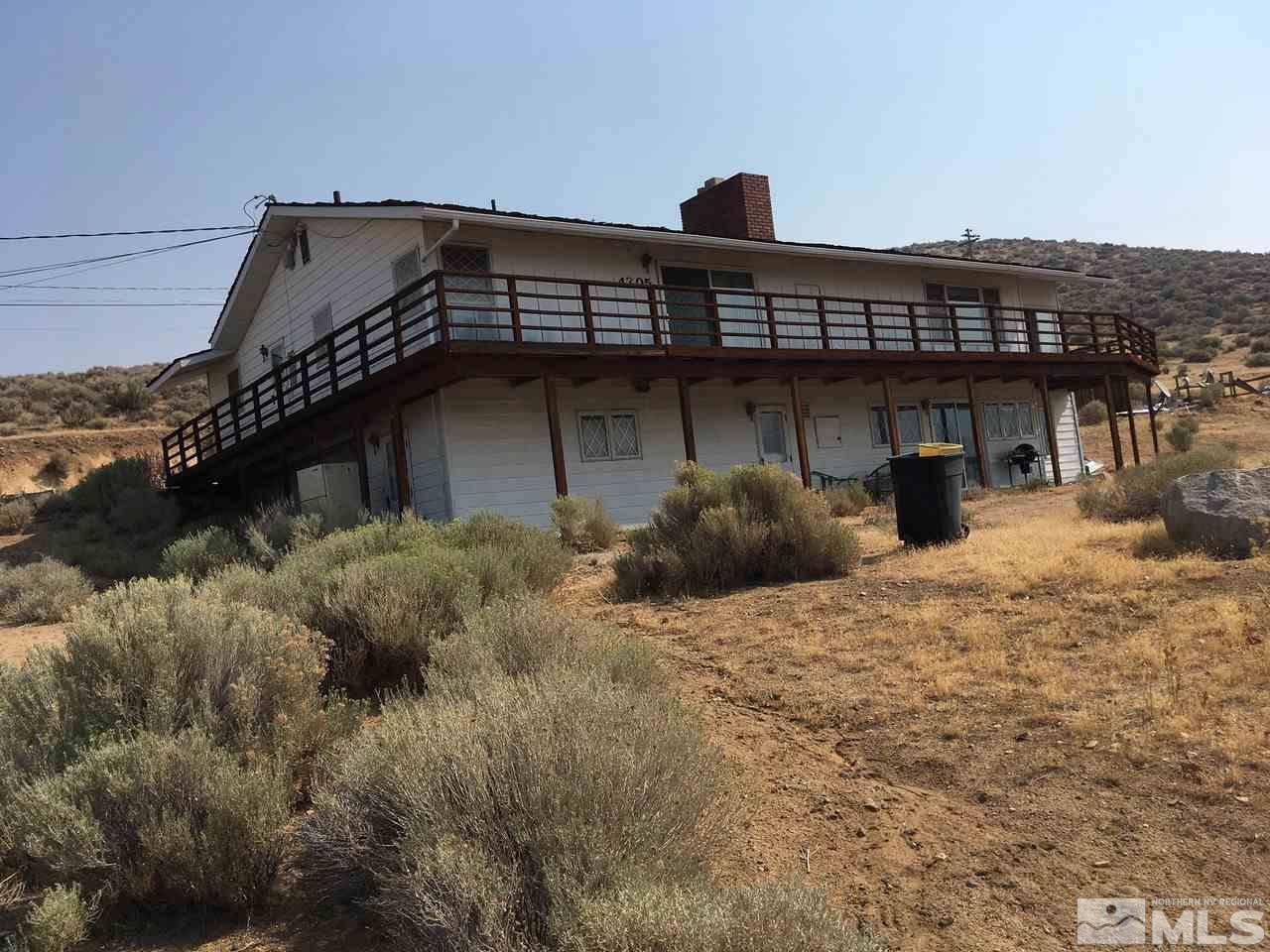 4305 Drake Way Washoe Valley, NV 89704 - Photo 18 of 21 a view of a house with a wooden deck