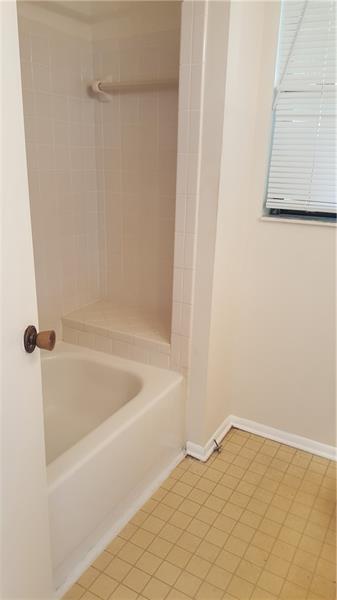 4541 West McNab Road, Unit 26 Pompano Beach, FL 33069 - Photo 9 of 12 a bathroom with a bathtub