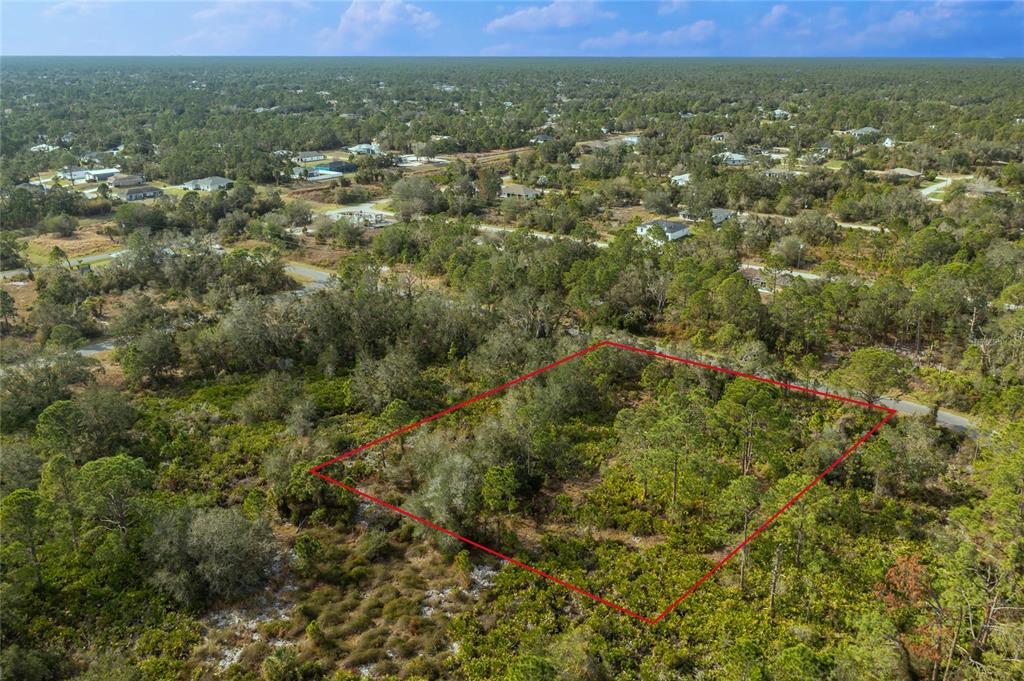 5 Tilhal Terrace North Port, FL 34291 - Photo 3 of 6 an aerial view of residential houses with outdoor and green space