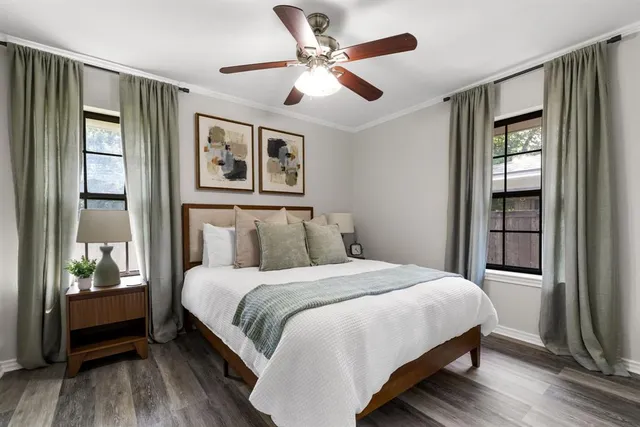 a bedroom with a large bed and a window