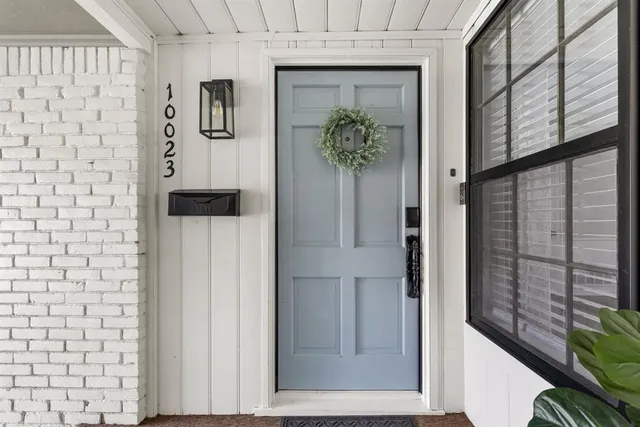 staircase with a potted plant on a wall