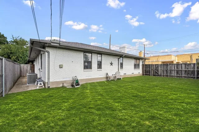 a house view with a sitting space and garden