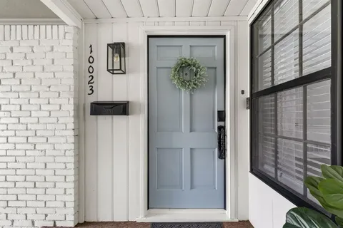 staircase with a potted plant on a wall