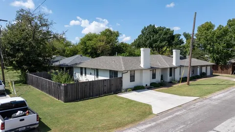 a view of a house with a yard and deck