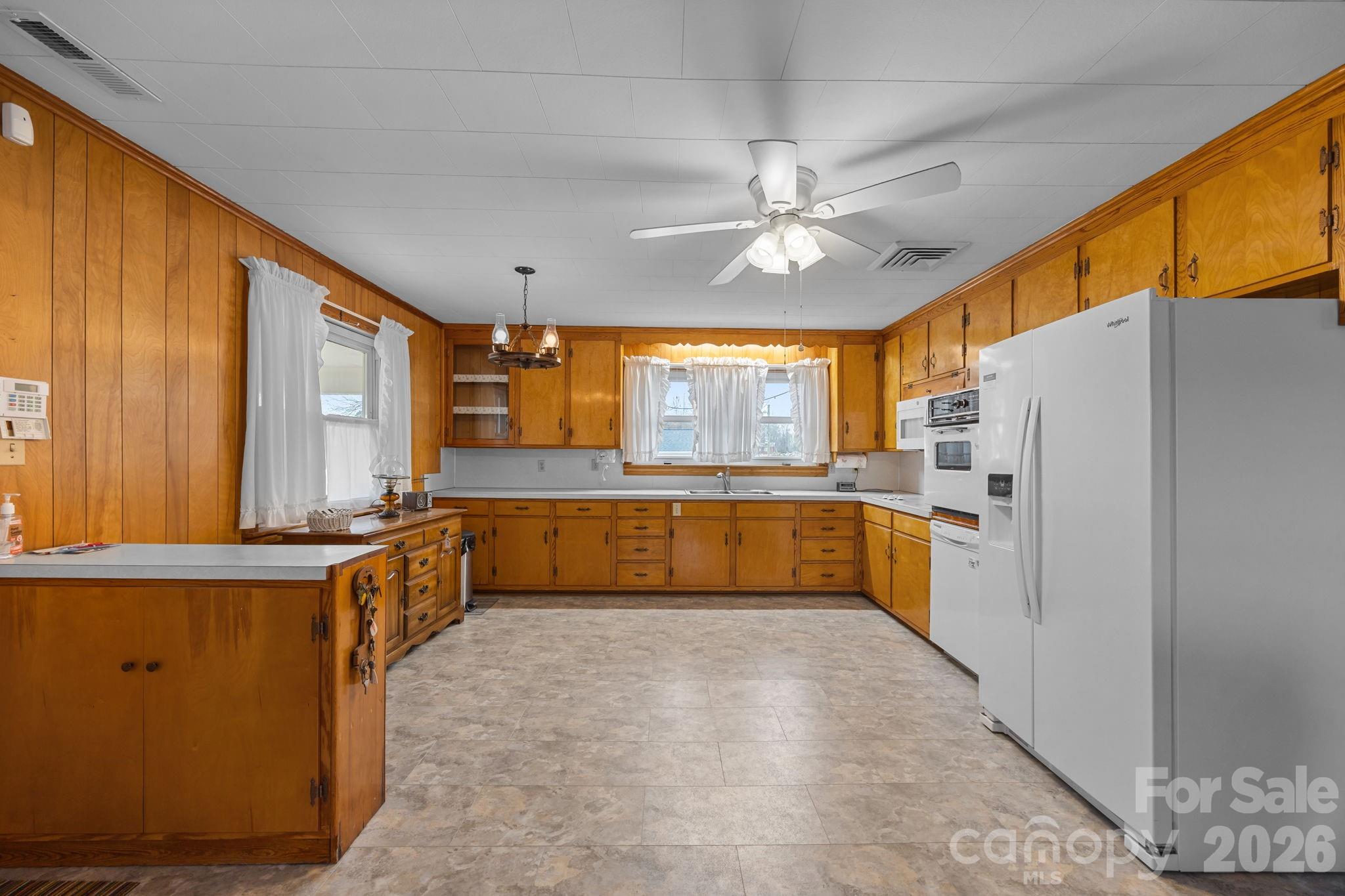 2050 Lake Road Salisbury, NC 28146 - Photo 14 of 41 a large white kitchen with a large window