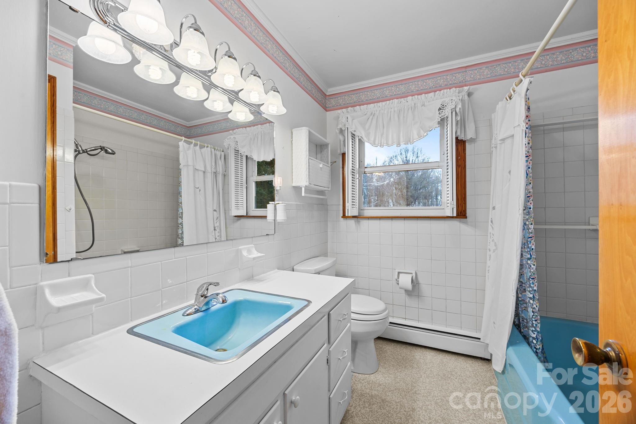 2050 Lake Road Salisbury, NC 28146 - Photo 21 of 41 a bathroom with a sink vanity granite tub and shower