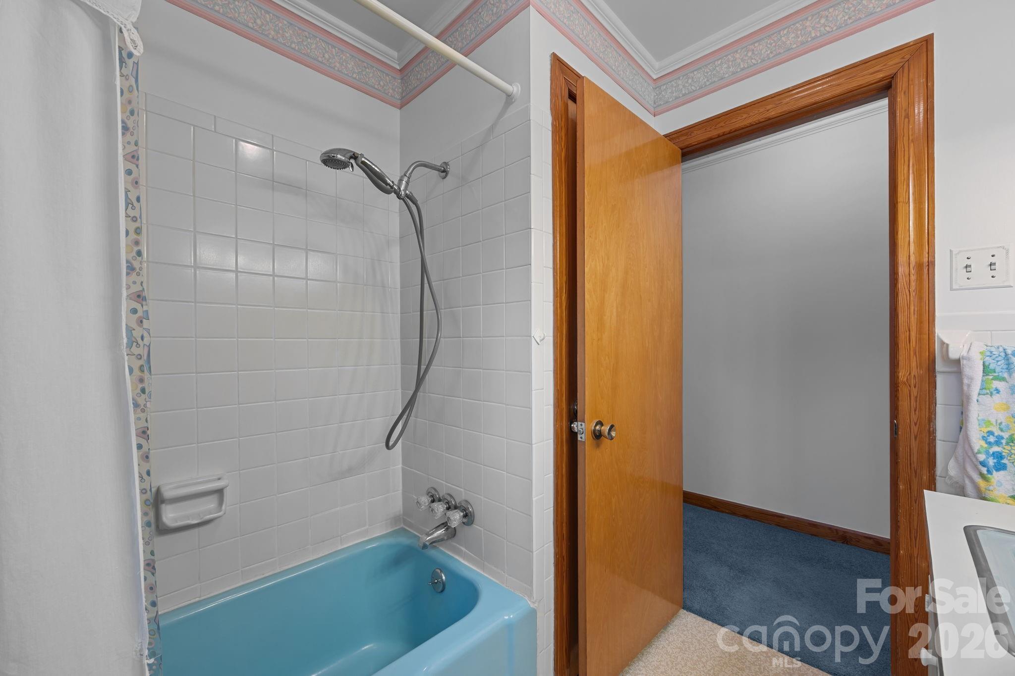 2050 Lake Road Salisbury, NC 28146 - Photo 22 of 41 a bathroom with a bathtub and a shower