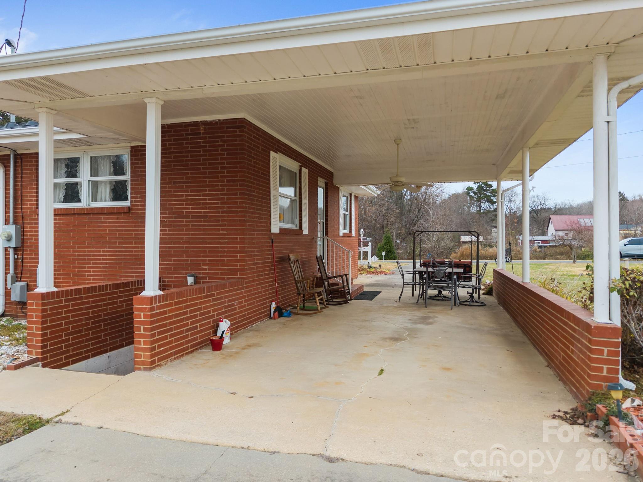 2050 Lake Road Salisbury, NC 28146 - Photo 27 of 41 a view of a patio with table and chairs and potted plants