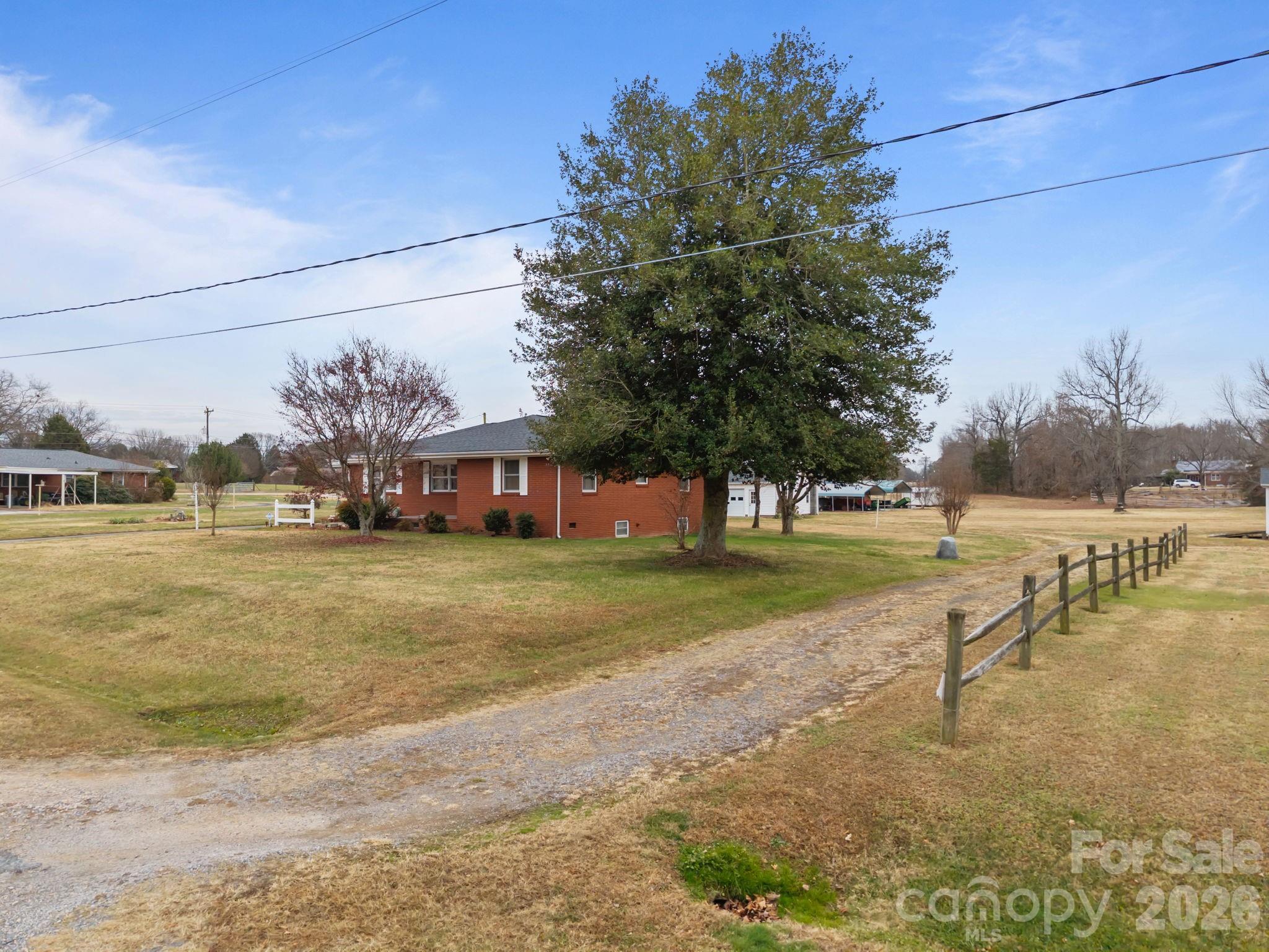 2050 Lake Road Salisbury, NC 28146 - Photo 5 of 41 a view of a house with a yard and sitting area