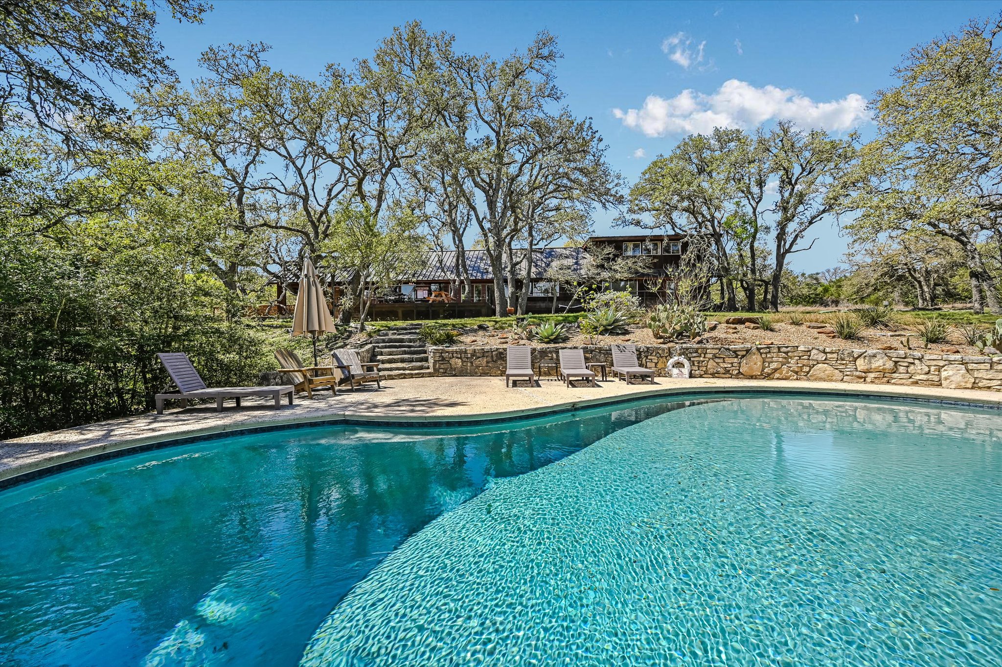 411 Whitetail Ridge Austin, TX 78737 - Photo 25 of 38 Swimming pool featuring a patio