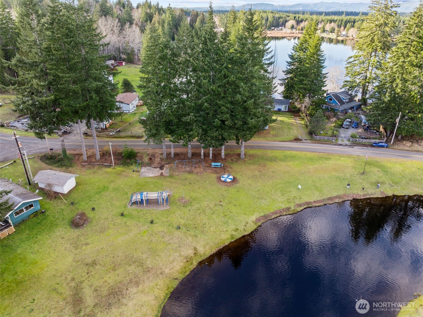 21 West Prairie Loop Road Elma, WA 98541 - Photo 27 of 40 a view of an outdoor space and swimming pool