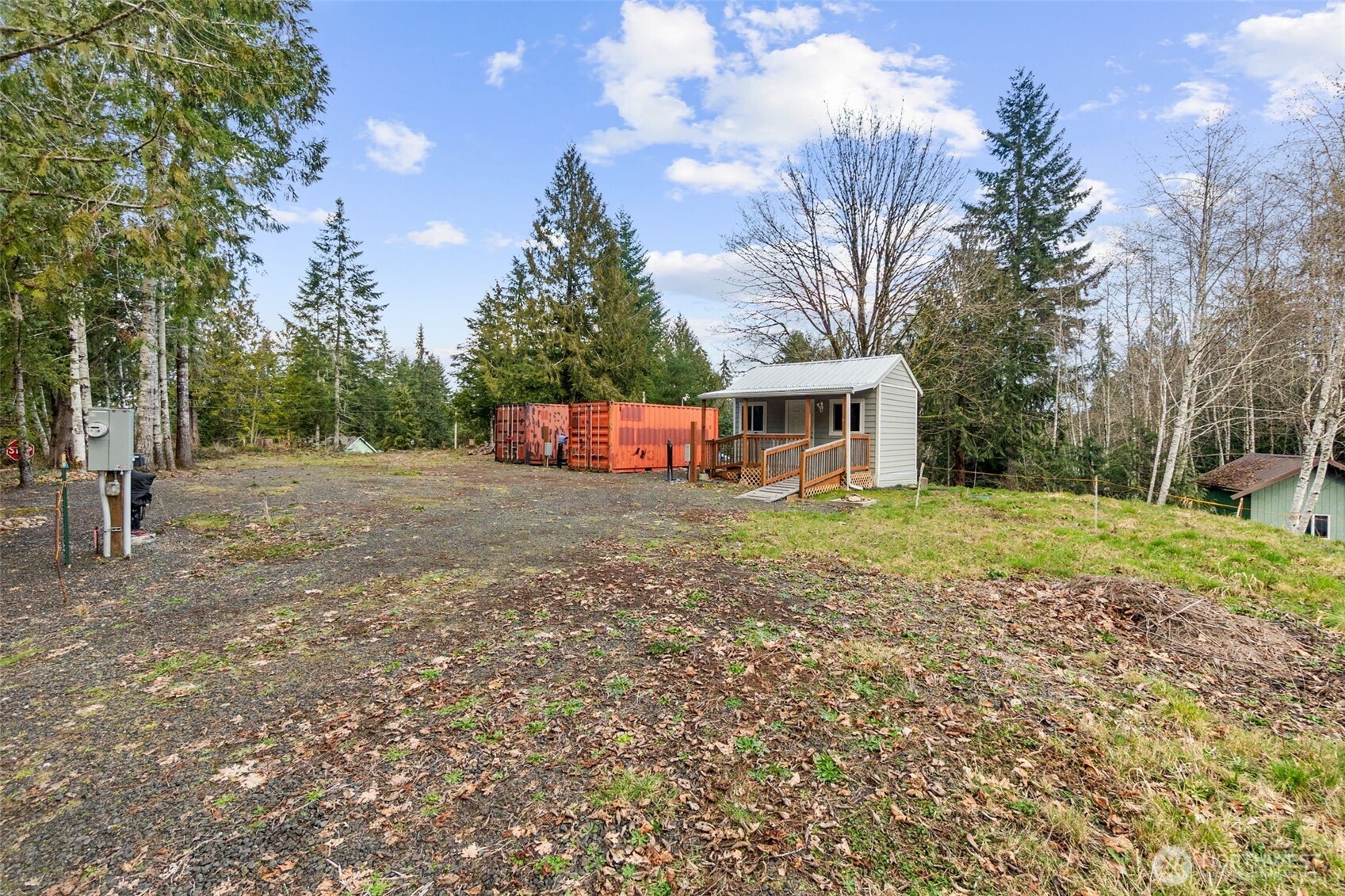 21 West Prairie Loop Road Elma, WA 98541 - Photo 3 of 40 a view of a house with backyard and trees