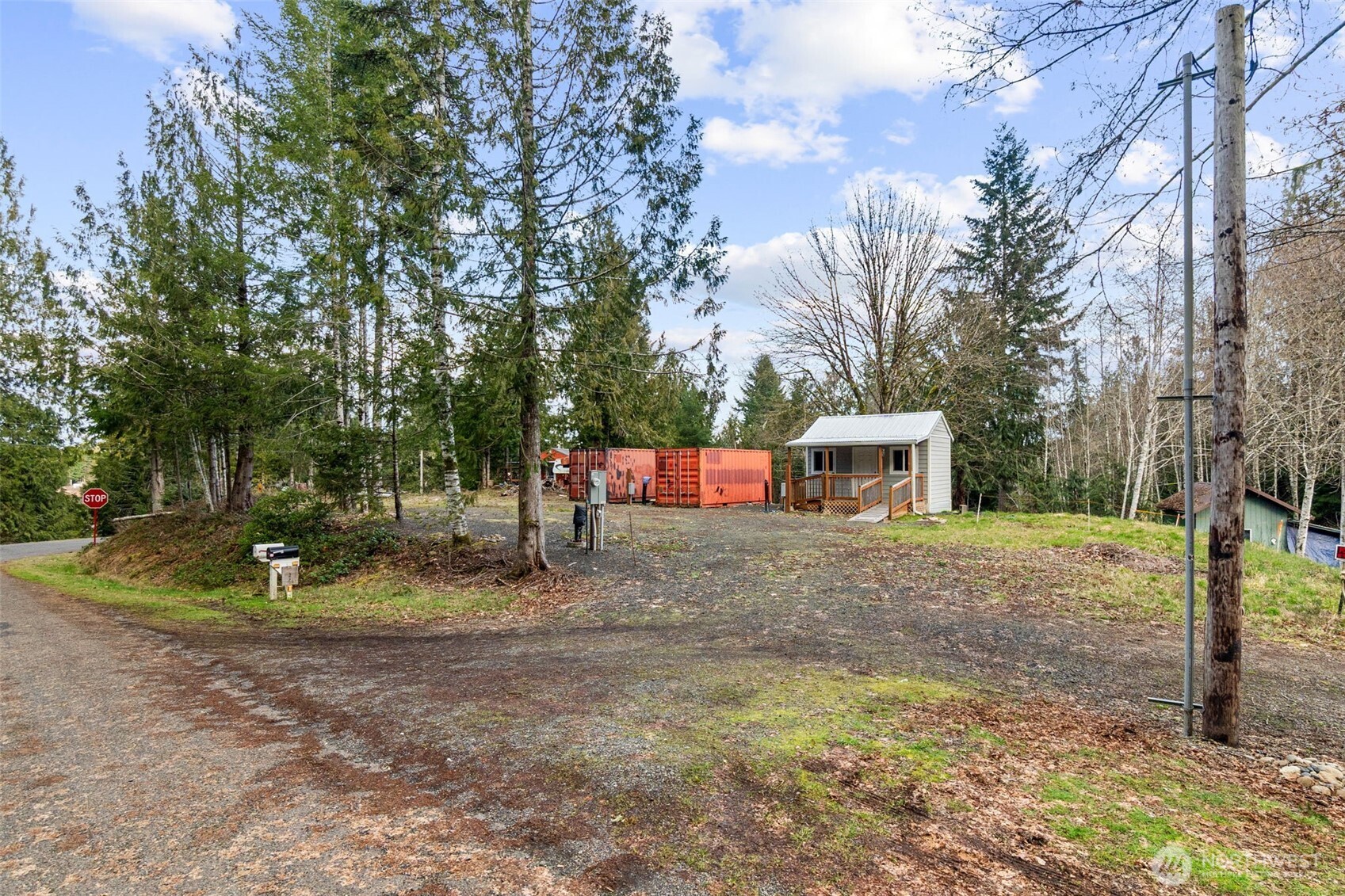 21 West Prairie Loop Road Elma, WA 98541 - Photo 40 of 40 a backyard of a house with fire pit and chairs