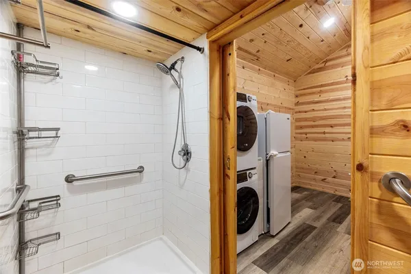 a view of a storage & utility room with a washer dryer