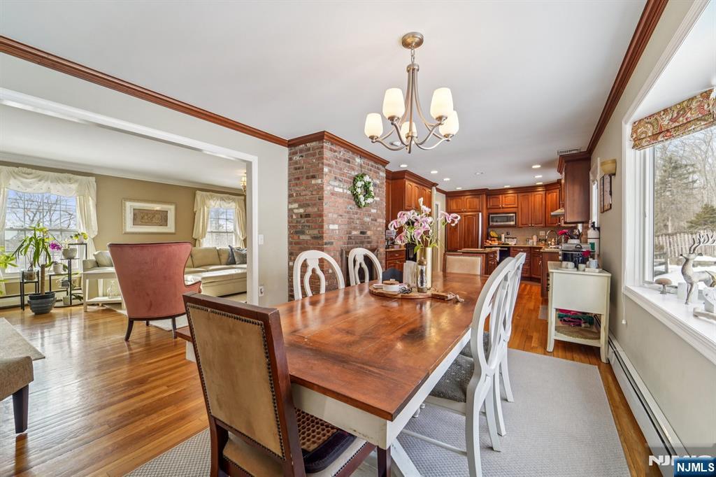 406 Indian Road Wayne, NJ 07470 - Photo 13 of 41 a view of a dining room with furniture window and wooden floor