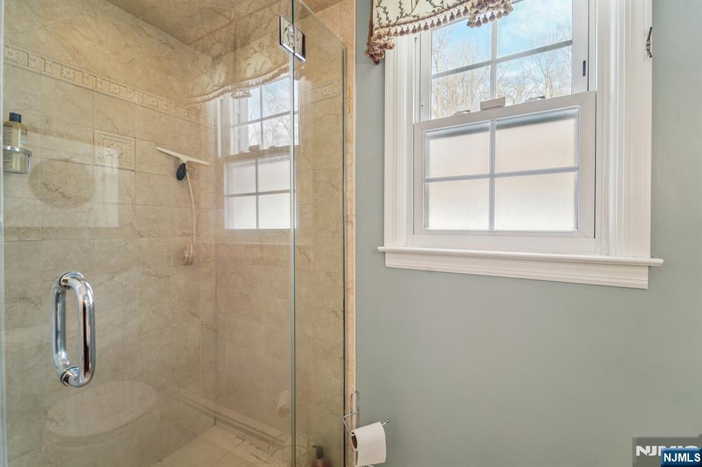 406 Indian Road Wayne, NJ 07470 - Photo 20 of 41 a bathroom with a shower