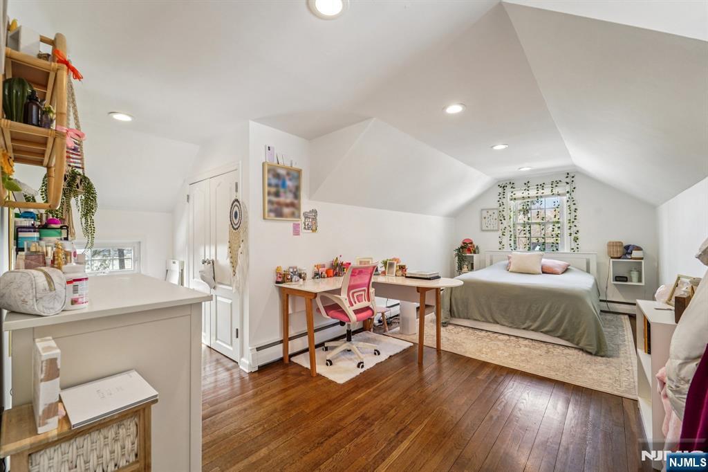 406 Indian Road Wayne, NJ 07470 - Photo 26 of 41 a bedroom with furniture and a wooden floor