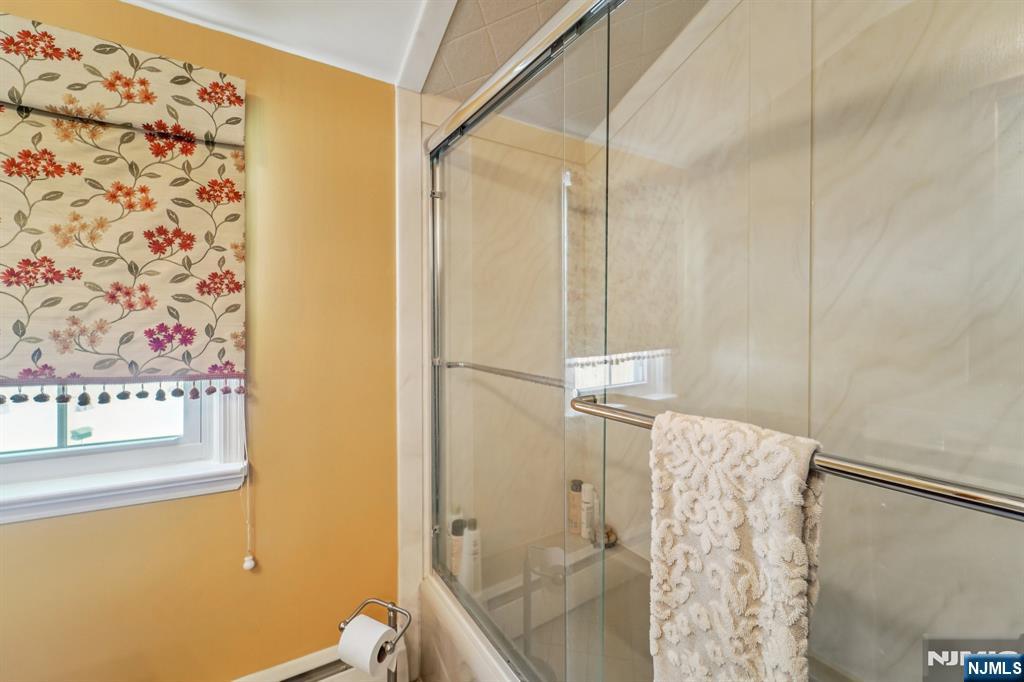 406 Indian Road Wayne, NJ 07470 - Photo 28 of 41 a bathroom with a shower and a toilet