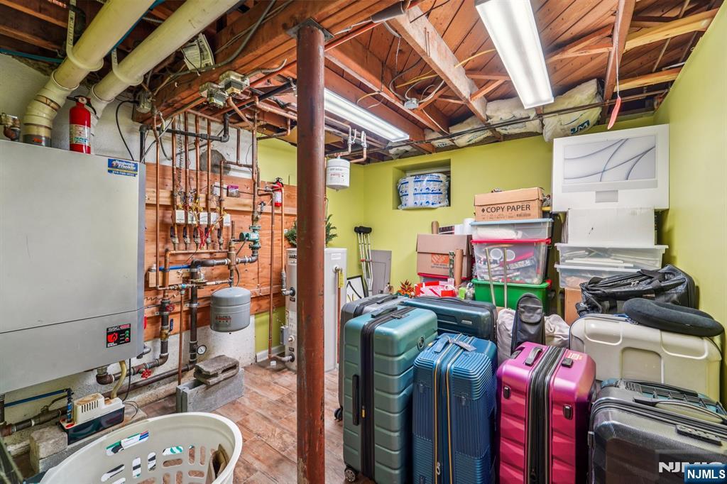 406 Indian Road Wayne, NJ 07470 - Photo 32 of 41 a storage room with washer and dryer