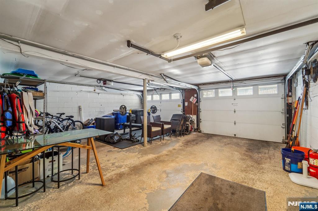 406 Indian Road Wayne, NJ 07470 - Photo 33 of 41 a view of a garage with rack and bicycle