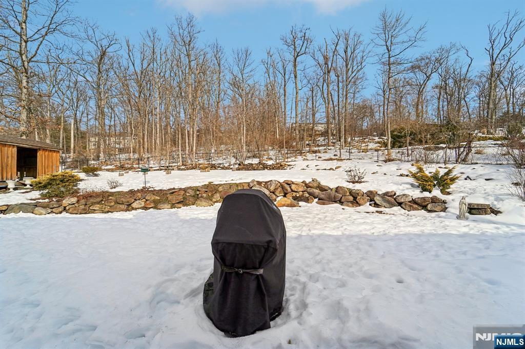 406 Indian Road Wayne, NJ 07470 - Photo 34 of 41 a view of yard covered with snow in front of house
