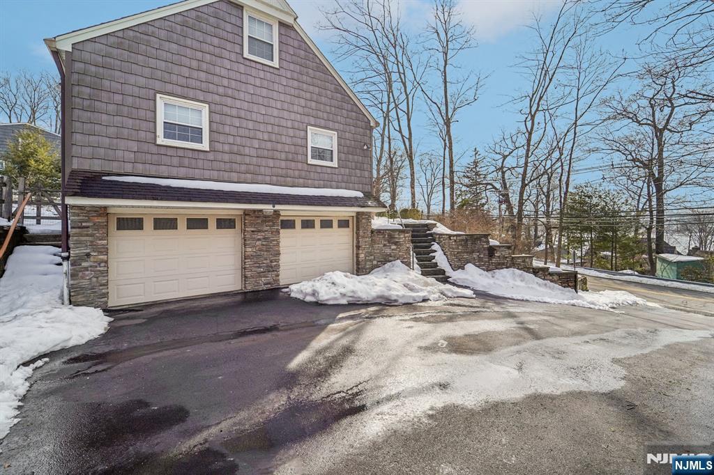 406 Indian Road Wayne, NJ 07470 - Photo 37 of 41 a view of a house with snow on the road