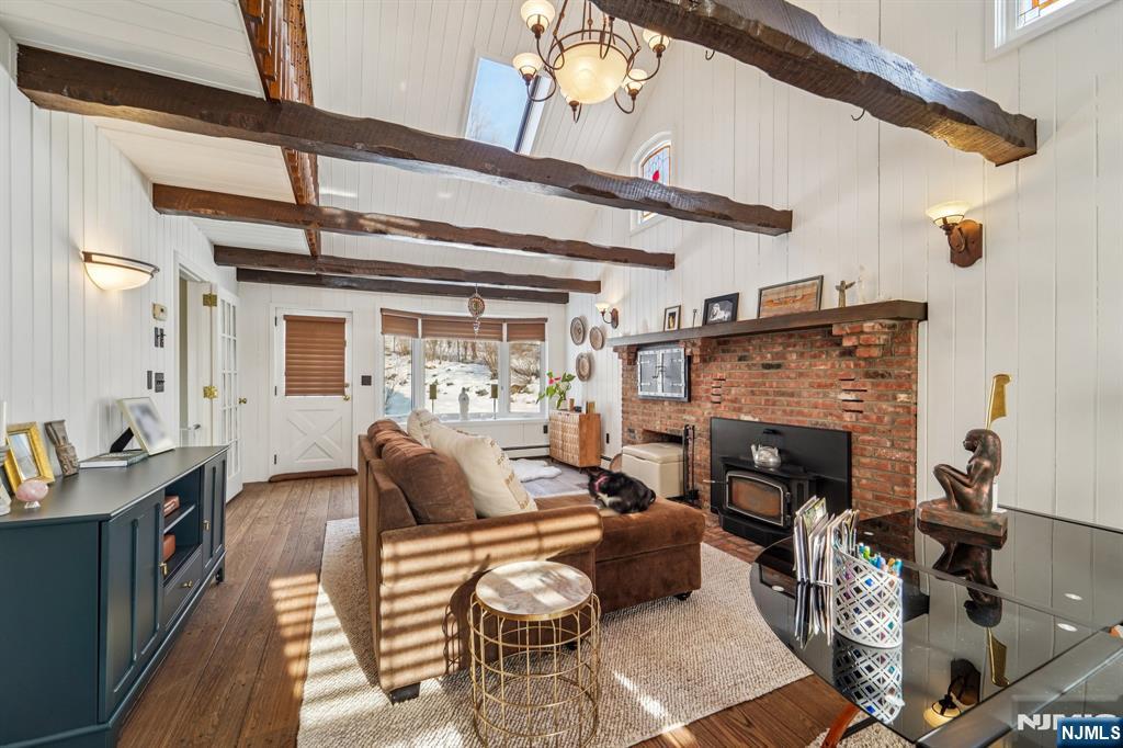 406 Indian Road Wayne, NJ 07470 - Photo 10 of 41 a living room with furniture and a fireplace