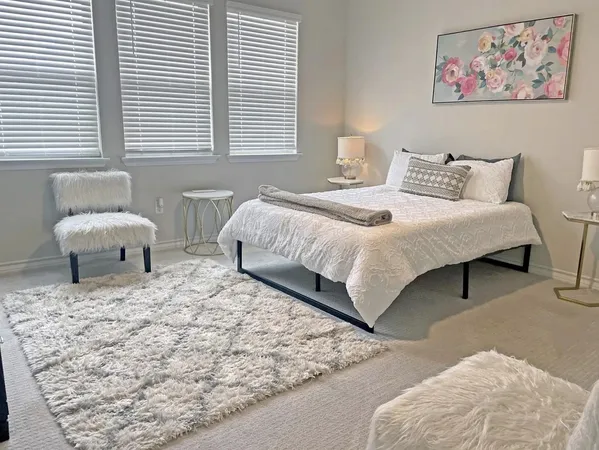 a bedroom with a bed and a couch
