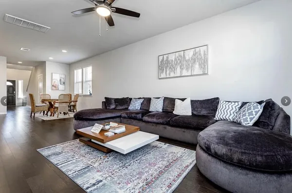 a living room with furniture and a rug
