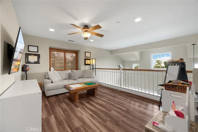 a kitchen with counter top space and wooden floor