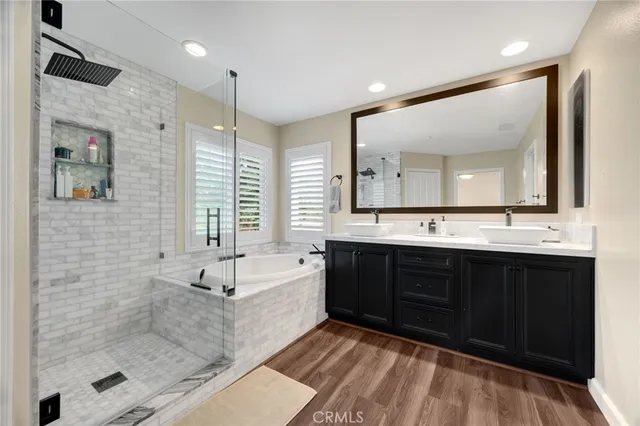 a bathroom with a bathtub and a shower