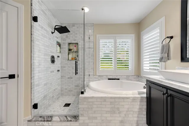 a bathroom with a shower and a sink