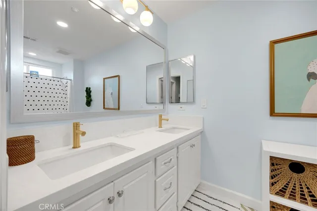 a white toilet sitting next to a bathroom sink