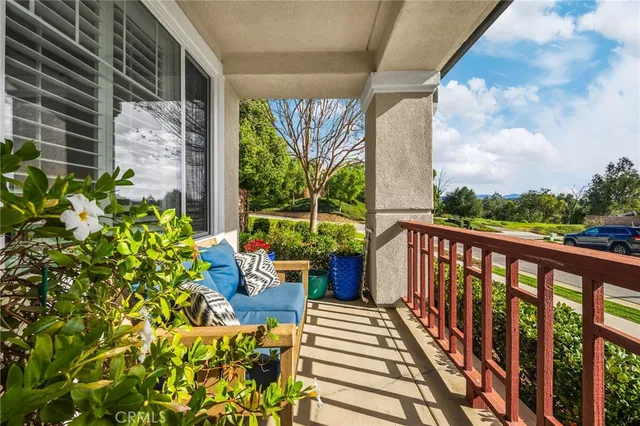 a view of a patio with table and chairs and potted plants