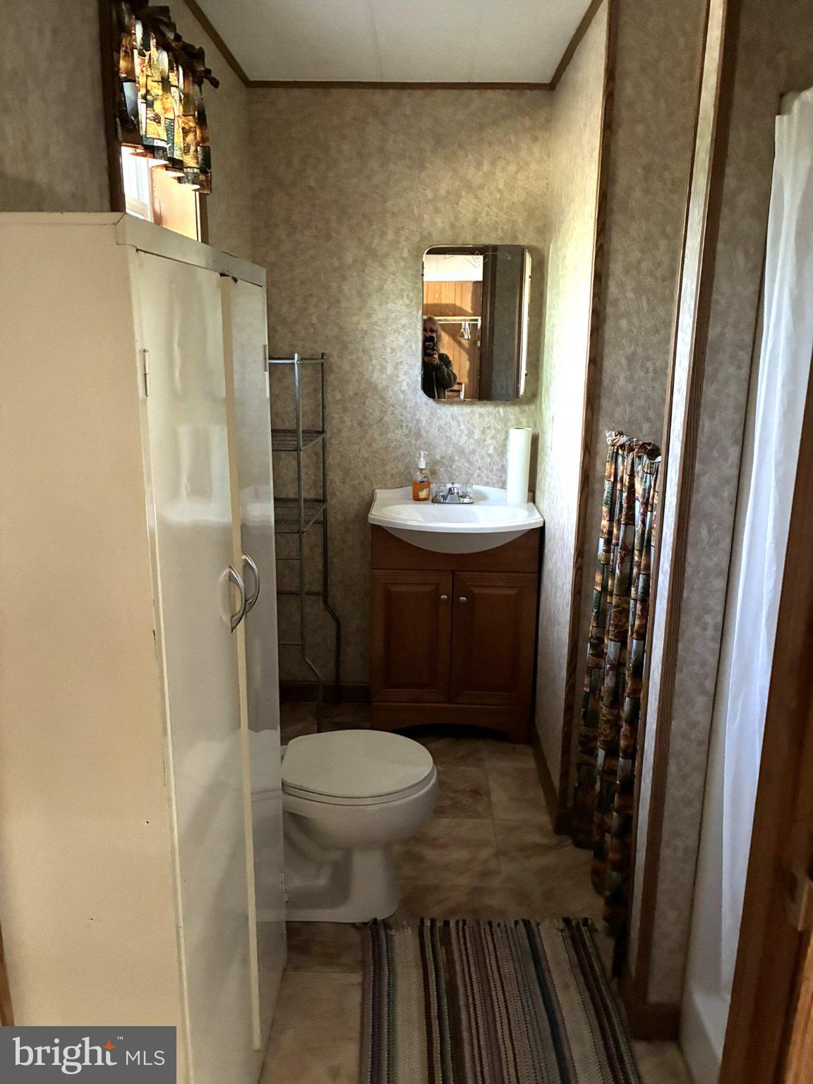 807 Sand Spring Road Beech Creek, PA 16822 - Photo 13 of 30 Cozy bathroom with vintage charm.